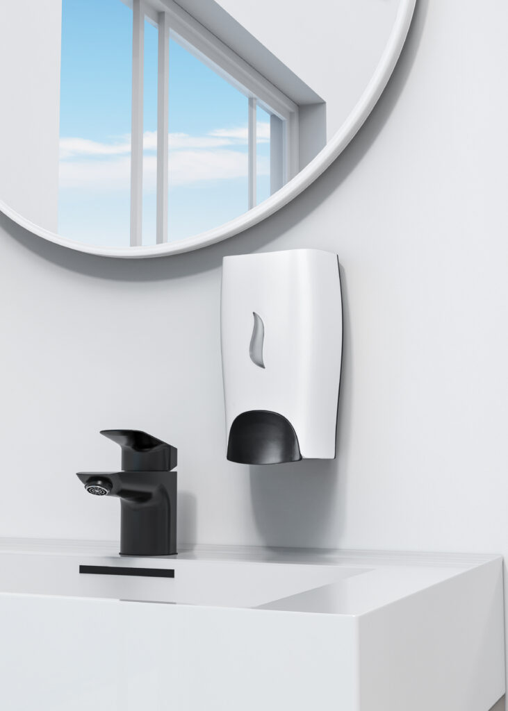 Wall mounted white and black soap dispenser installed above a modern bathroom sink with a black faucet reflecting a clean and minimalist washroom interior