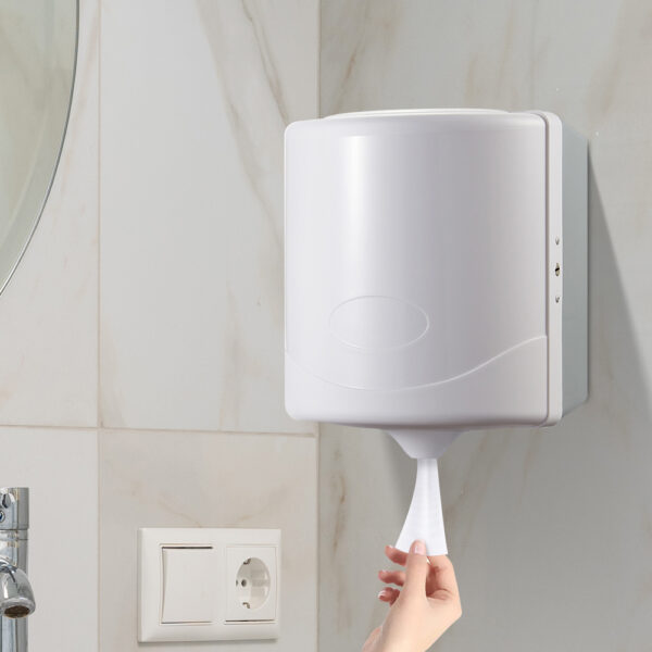 White center pull paper towel dispenser mounted on a bathroom wall The dispenser features a sleek matte white plastic design