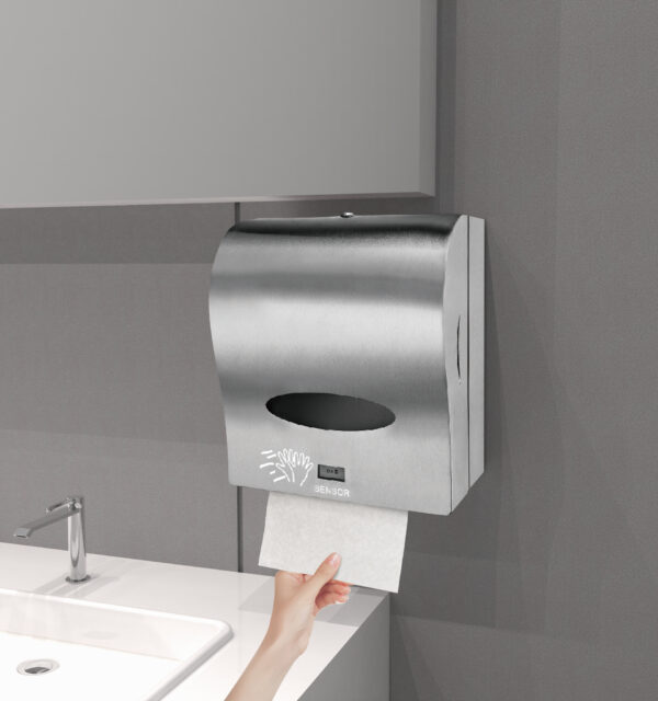 Wall mounted stainless steel automatic paper towel dispenser The dispenser features a sensor icon and a black viewing window