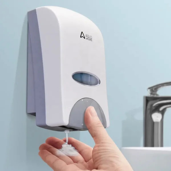 Wall mounted white soap dispenser front viewing window for checking liquid levels bathroom or washroom setting