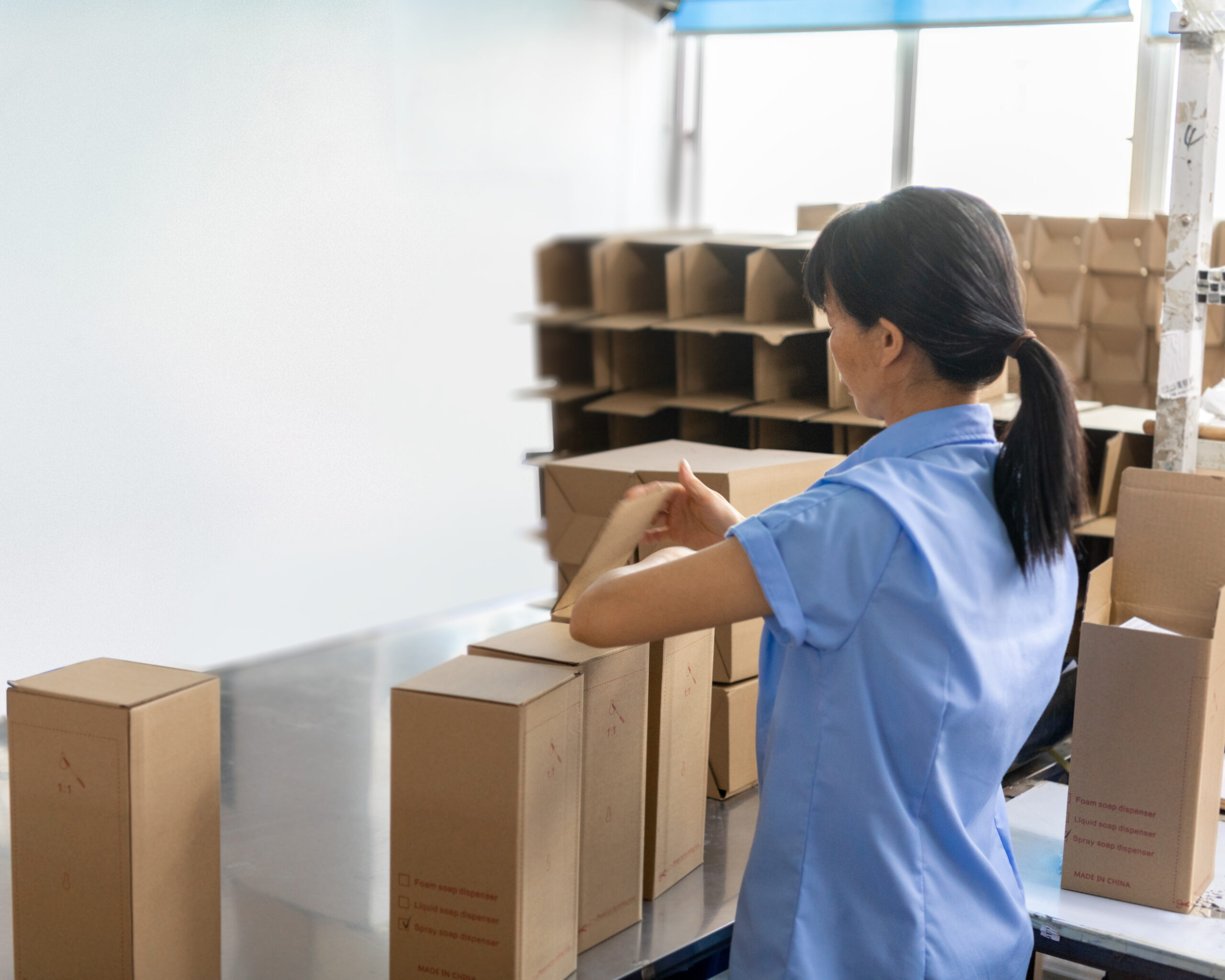 Aolq staff carefully packaging hygiene products to ensure safe delivery and professional presentation for global clients