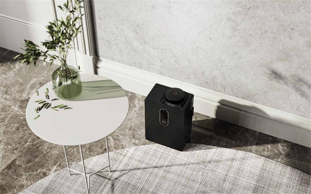 Professional Hvac Scent Diffusers for Modern Homes Aolq | Top Public Hygiene Solutions Oemodm Manufacturer Black hvac scent diffuser on marble floor beside a white table with a plant featuring a minimalist aesthetic